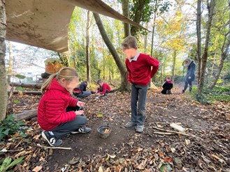 Children of Seaton Primary School in a Forest School session.