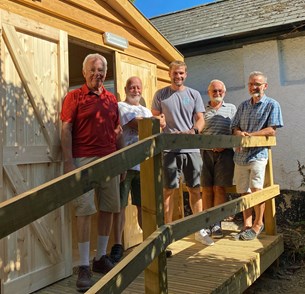Members of Beer Men's Shed outside the new workshop.